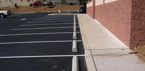 Wheelstop installation in a parking lot in Charlotte NC